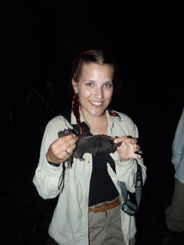 Bella Luna holding a bat during her research